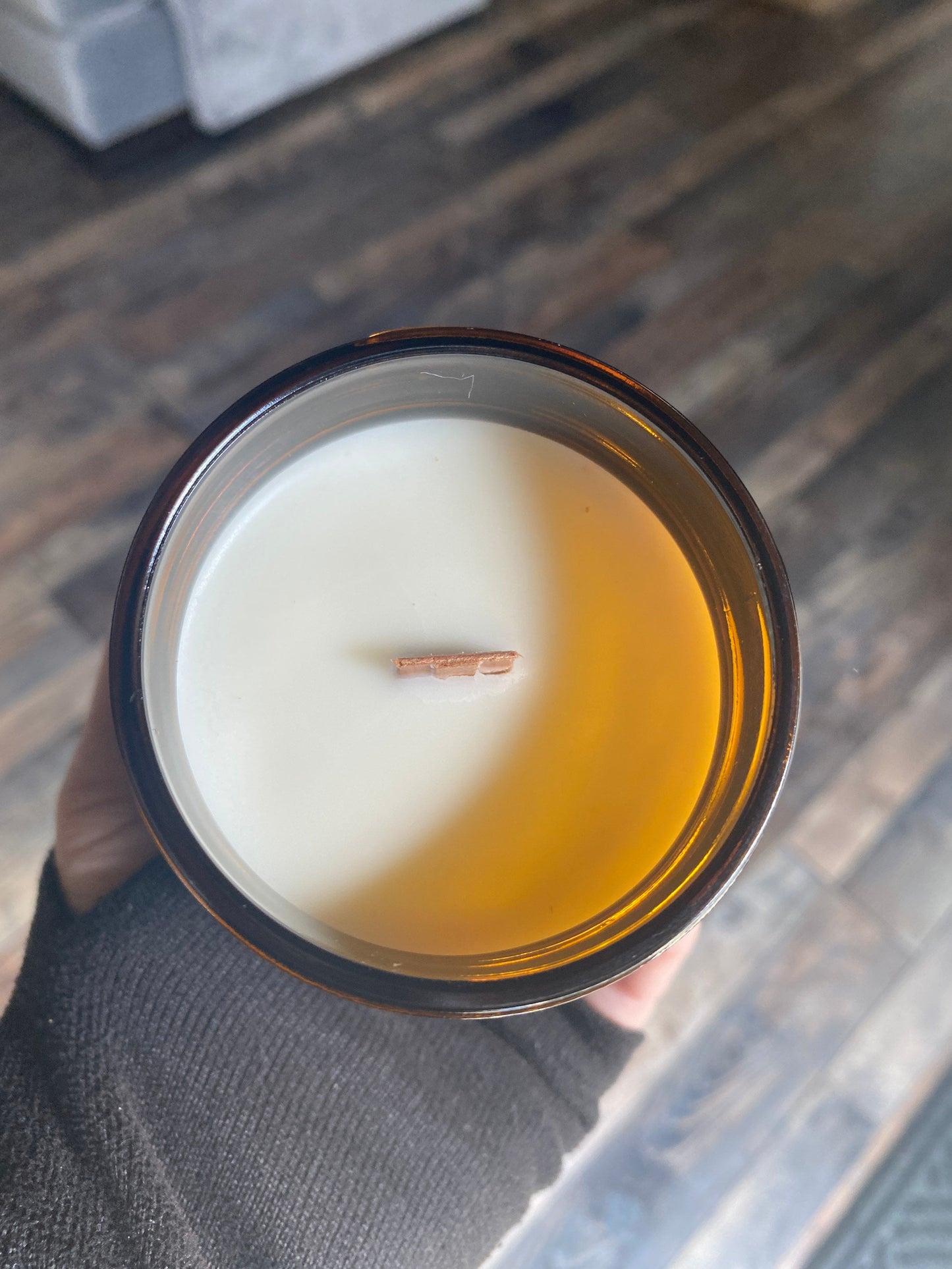 Headache, wooden wick, aromatherapy candle, soy wax candle - The Preachers Daughter Candle Co
An Amber colored glass 9 oz jar candle sits on a marble surface.  The jar is shown from above revealing creamy white wax and a wooden wick.
